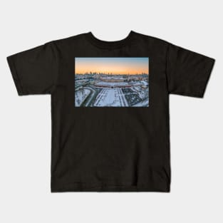 Warsaw Royal Castle, snow-covered roofs and and distant city center at dusk Kids T-Shirt